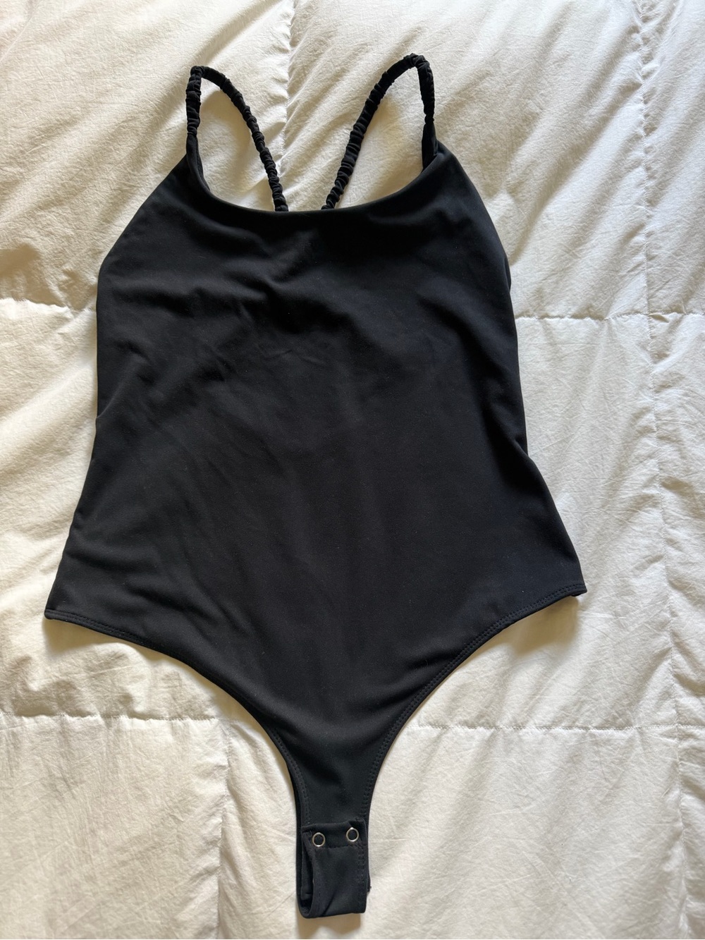 Women’s Black One-Piece Bodysuit with Twisted Straps - size M